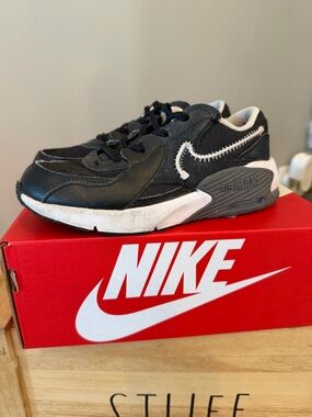 Nike Kids Black and White Sneakers with Stitched Swoosh